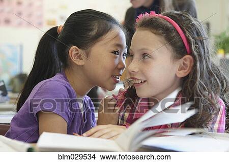 Students whispering in class View Large Photo Image Picture - Students whispering in class. Fotosearch