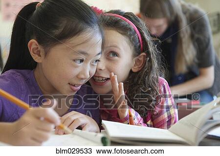 Students whispering in class View Large Photo Image Stock Image - Students whispering in class. Fotosearch