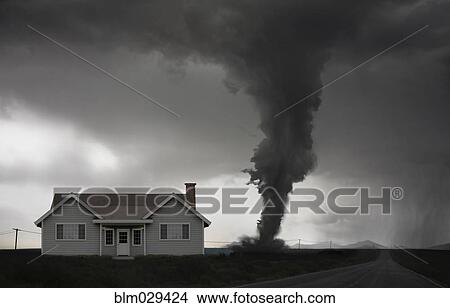 Picture - Tornado approaching house in rural landscape. Fotosearch