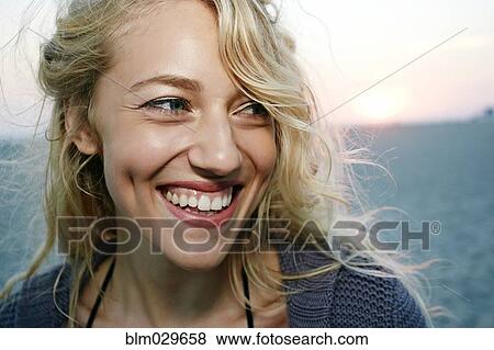 Woman smiling on beach View Large Photo Image Stock Photo - Woman smiling on beach. Fotosearch