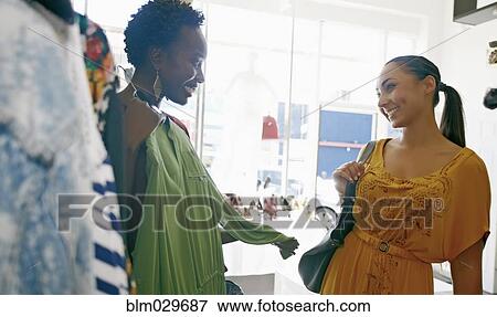 Women shopping together in store View Large Photo Image Stock Photo - Women shopping together in store. Fotosearch