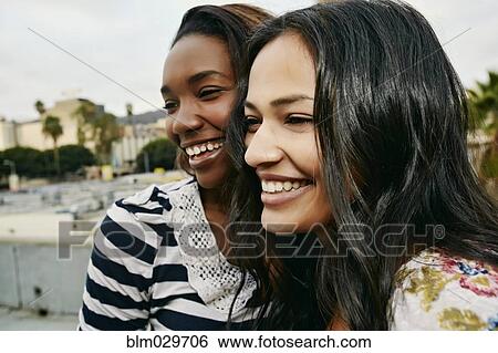 Women smiling on urban rooftop View Large Photo Image Stock Photograph - Women smiling on urban rooftop. Fotosearch