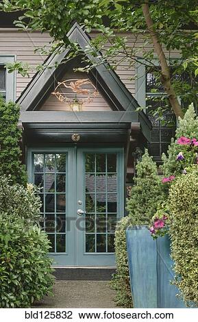 Stock Image - Archway over double doors of house. Fotosearch