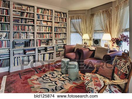 Picture - Armchairs and bookcases in living room. Fotosearch