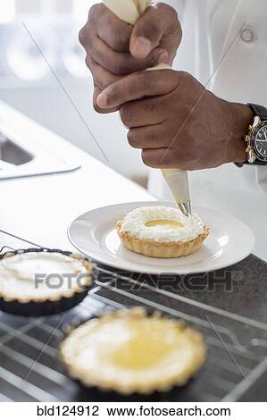 Black chef making key lime tart in restaurant View Large Photo Image Stock Image - Black chef making key lime tart in restaurant. Fotosearch