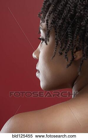 Stock Photography - Black woman looking over her shoulder. Fotosearch
