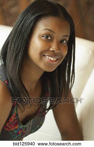 Stock Image - Black woman smiling. Fotosearch