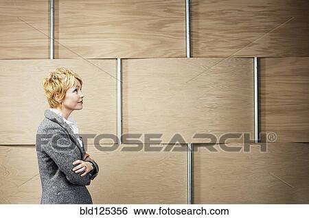 Caucasian businesswoman standing with arms crossed View Large Photo Image Stock Photograph - Caucasian businesswoman standing with arms crossed. Fotosearch