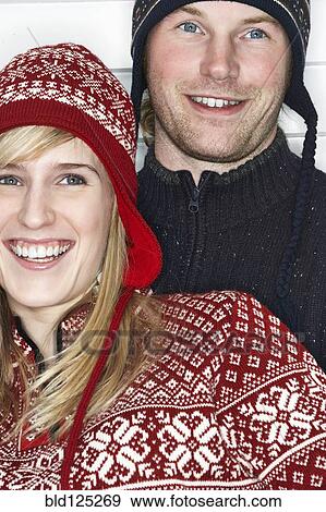 Stock Photo - Caucasian couple wearing winter hats. Fotosearch