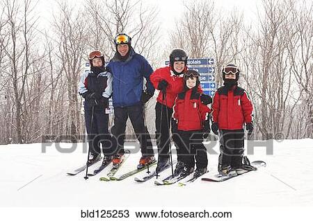 Caucasian family on ski slope View Large Photo Image Stock Image - Caucasian family on ski slope. Fotosearch