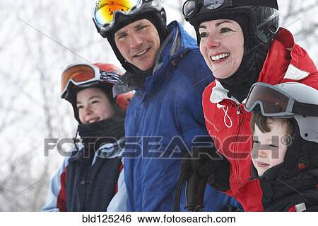 Caucasian family wearing ski gear in snow View Large Photo Image Stock Photograph - Caucasian family wearing ski gear in snow. Fotosearch