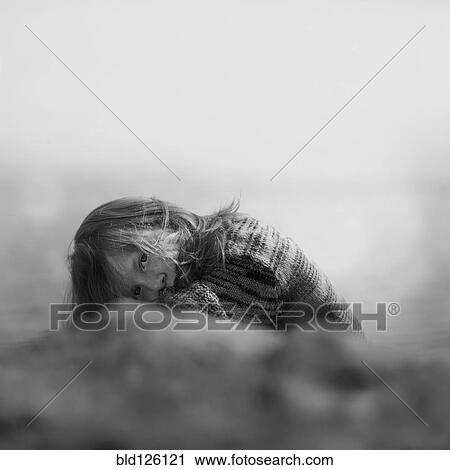 Caucasian girl crouched outdoors View Large Photo Image Stock Image - Caucasian girl crouched outdoors. Fotosearch