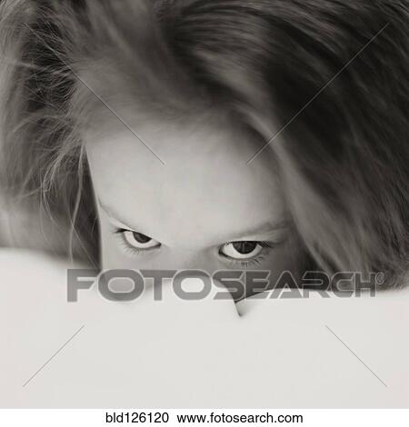 Caucasian girl peering over bed covers View Large Photo Image Stock Image - Caucasian girl peering over bed covers. Fotosearch