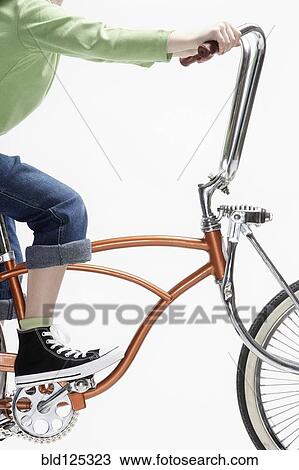 Caucasian girl riding bicycle View Large Photo Image Stock Image - Caucasian girl riding bicycle. Fotosearch