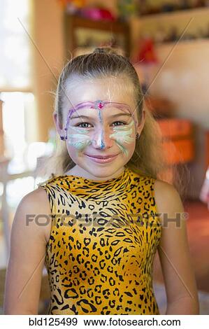 Stock Photo - Caucasian girl wearing face paint and costume. Fotosearch