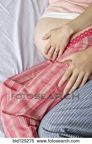 Caucasian lesbian couple holding pregnant belly View Large Photo Image Stock Photography - Caucasian lesbian couple holding pregnant belly. Fotosearch