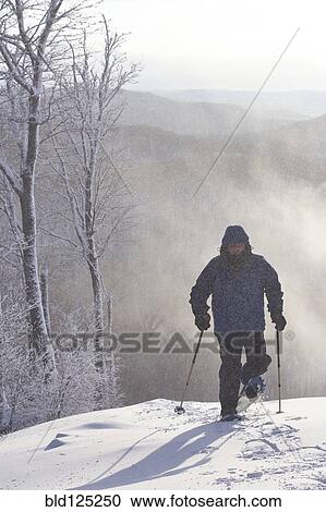 Caucasian man snowshoeing View Large Photo Image Stock Image - Caucasian man snowshoeing. Fotosearch