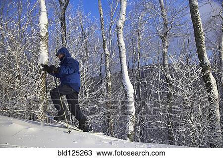 Caucasian man snowshoeing View Large Photo Image Stock Image - Caucasian man snowshoeing. Fotosearch