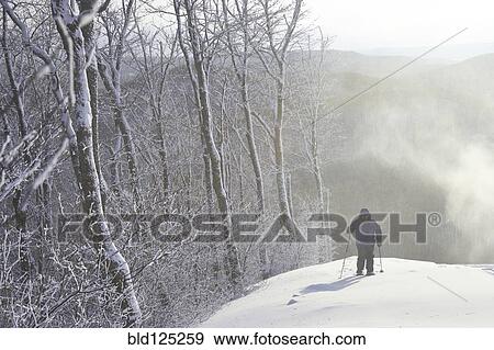 Caucasian man snowshoeing View Large Photo Image Stock Photo - Caucasian man snowshoeing. Fotosearch