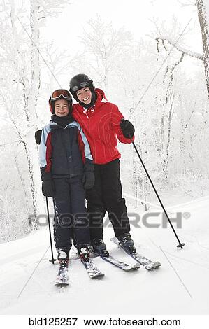 Caucasian mother and daughter cross country skiing in snow View Large Photo Image Stock Photo - Caucasian mother and daughter cross country skiing in snow. Fotosearch