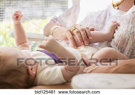 Caucasian mother playing with baby boy View Large Photo Image Stock Image - Caucasian mother playing with baby boy. Fotosearch