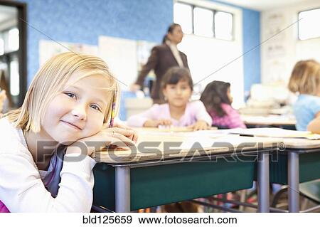 Caucasian student smiling in class View Large Photo Image Stock Photo - Caucasian student smiling in class. Fotosearch