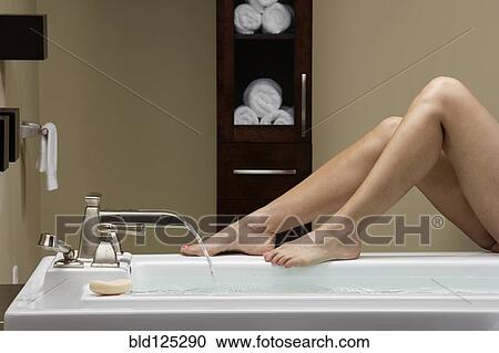 Caucasian woman running bath View Large Photo Image Stock Image - Caucasian woman running bath. Fotosearch