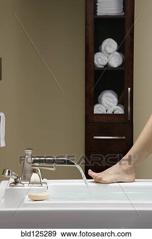 Caucasian woman running bath View Large Photo Image Stock Photo - Caucasian woman running bath. Fotosearch