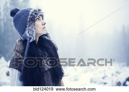 Caucasian woman standing in snowy woods View Large Photo Image Stock Photo - Caucasian woman standing in snowy woods. Fotosearch