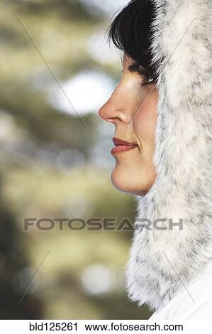 Caucasian woman wearing fur hood in snow View Large Photo Image Stock Image - Caucasian woman wearing fur hood in snow. Fotosearch