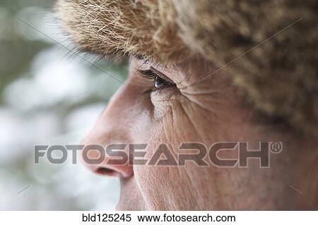 Close up of Caucasian man wearing furry hat in snow View Large Photo Image Stock Photography - Close up of Caucasian man wearing furry hat in snow. Fotosearch