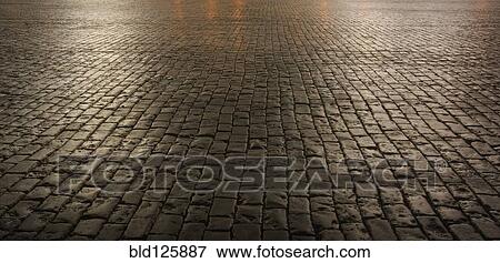 Close up of cobblestone street at night View Large Photo Image Stock Photo - Close up of cobblestone street at night. Fotosearch