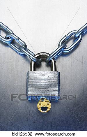 Stock Image - Close up of padlock, key and chain. Fotosearch