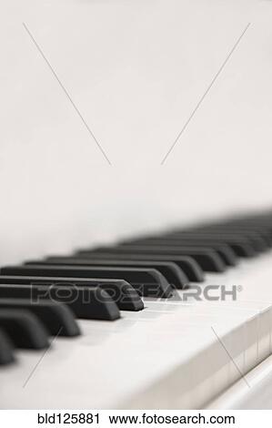 Stock Image - Close up of piano keys. Fotosearch