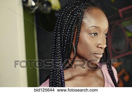 Picture - Close up of serious Black woman. Fotosearch