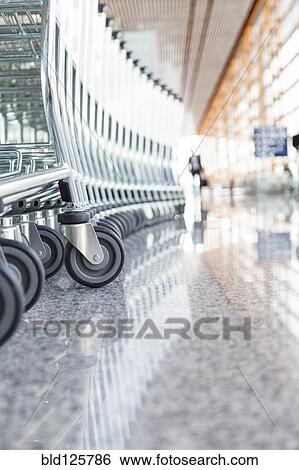 Close up of wheels of stacked airport carts View Large Photo Image Stock Photograph - Close up of wheels of stacked airport carts. Fotosearch