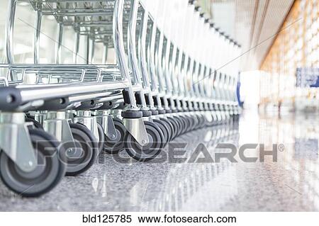 Close up of wheels of stacked airport carts View Large Photo Image Stock Photography - Close up of wheels of stacked airport carts. Fotosearch