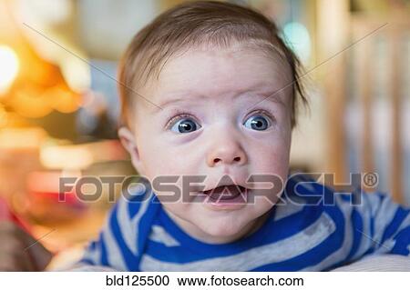 Close up of wide-eyed Caucasian baby boy View Large Photo Image Stock Image - Close up of wide-eyed Caucasian baby boy. Fotosearch