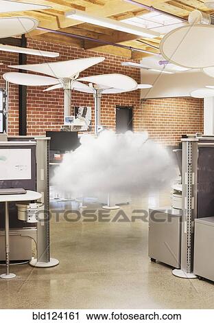 Stock Image - Cloud hovering in modern office. Fotosearch