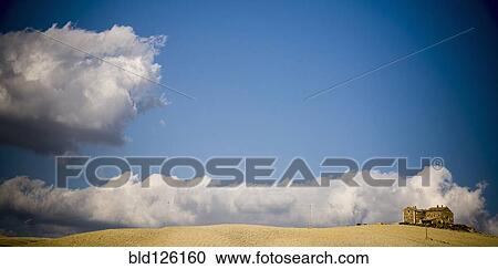 Clouds rolling over estate in rural landscape View Large Photo Image Stock Image - Clouds rolling over estate in rural landscape. Fotosearch