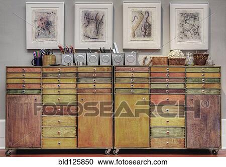 Stock Image - Colorful wooden drawers in cabinet. Fotosearch