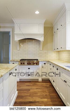Counters and cabinets in luxury kitchen View Large Photo Image Stock Image - Counters and cabinets in luxury kitchen. Fotosearch