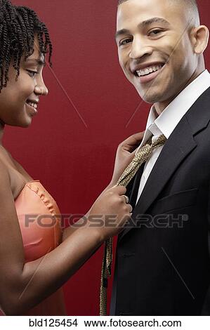 Picture - Couple admiring each other in formalwear. Fotosearch