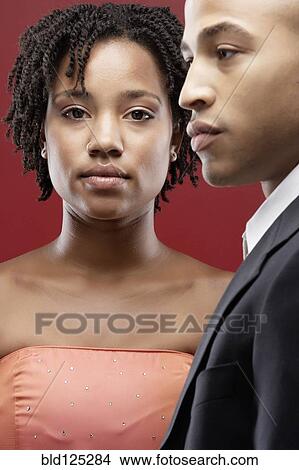 Picture - Couple wearing evening gown and tuxedo. Fotosearch