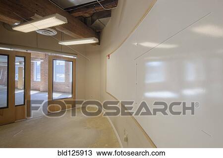 Stock Image - Empty conference room with white board. Fotosearch