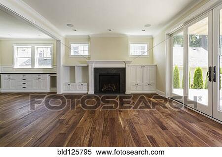 Stock Photography - Fireplace and built-in shelves in living room. Fotosearch