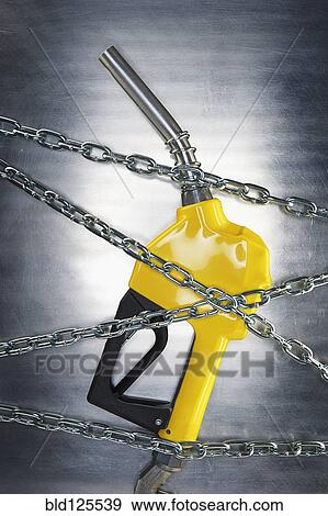 Stock Photo - Gasoline pump nozzle tangled in chains. Fotosearch