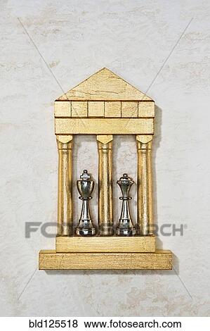 Golden model of king and queen chess pieces View Large Photo Image Stock Photo - Golden model of king and queen chess pieces. Fotosearch