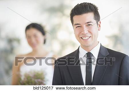 Stock Photo - Groom smiling in wedding ceremony. Fotosearch