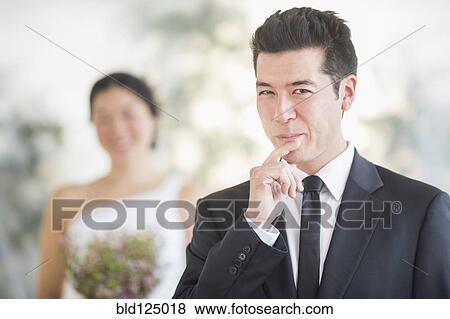 Groom smiling in wedding ceremony View Large Photo Image Stock Photo - Groom smiling in wedding ceremony. Fotosearch